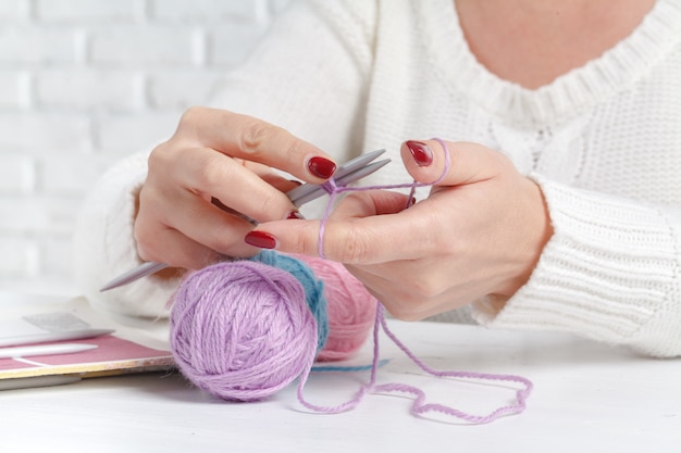 Female hands holding yarn