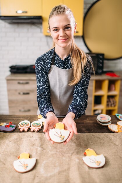 Female hands holds sweet cookies with pictures