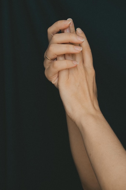 female hands intertwined fingers