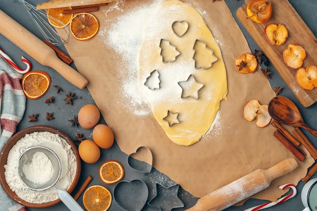 Female hands making cookies from fresh dough at home