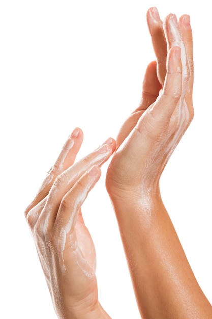 Female hands and moisturizing cream