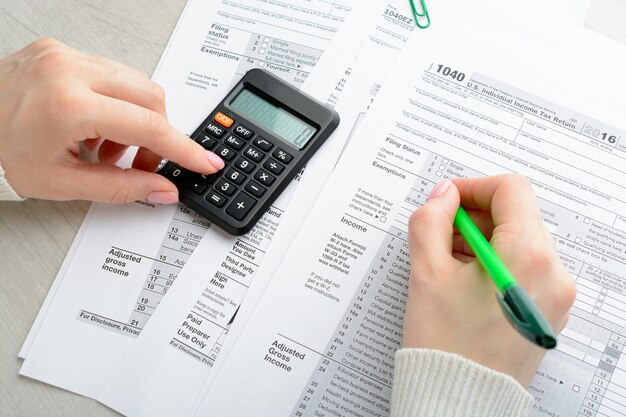 Female hands and tax form