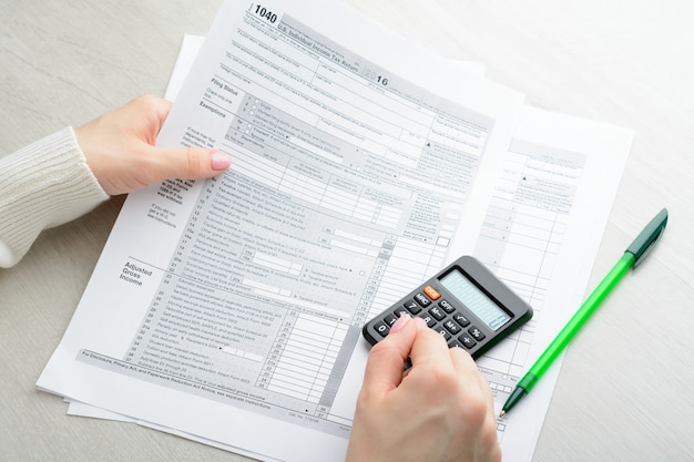 Female hands and tax form