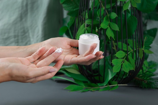 female hands try the density of face cream