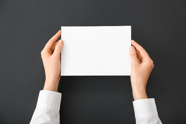 Female hands with blank paper