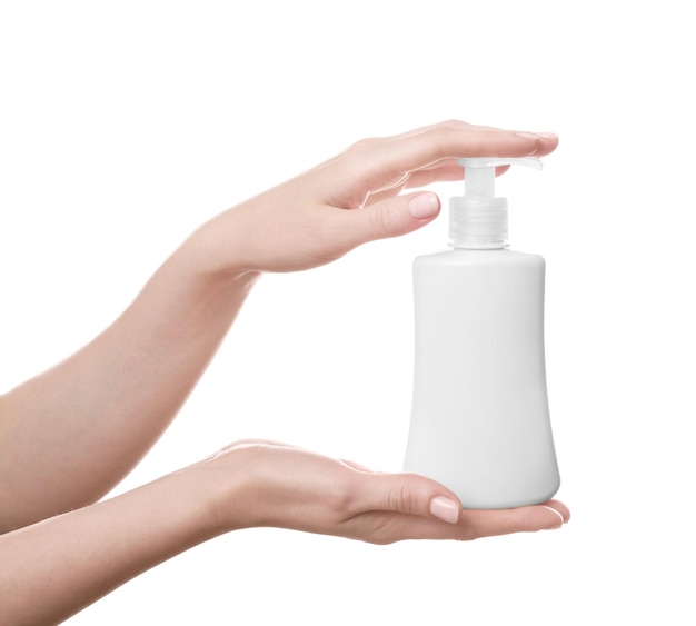 Female hands with bottle of cosmetic product for shower on white background