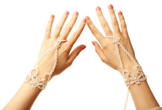 Female hands with bracelets isolated on white