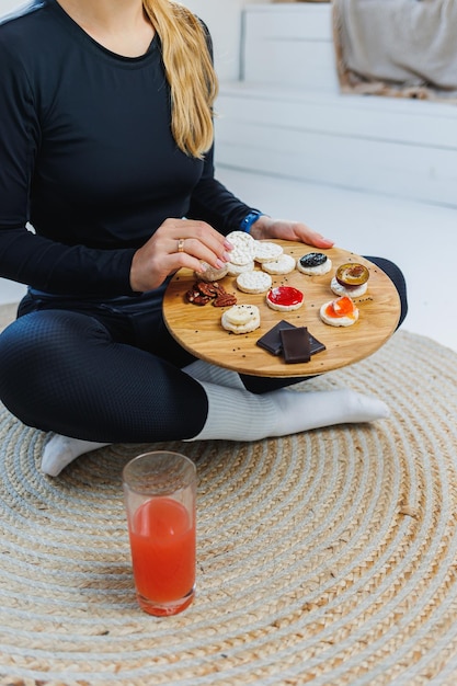 Female hands with bread Delicious dry breakfasts Fitness bread for a quick snack Rice cakes