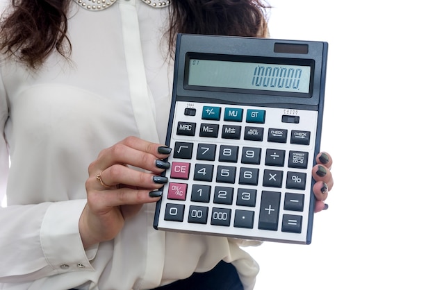 Female hands with calculator closeup isolated on white