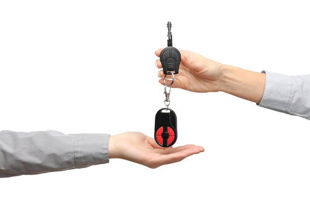 Female hands with car keys on white background Buying car concept