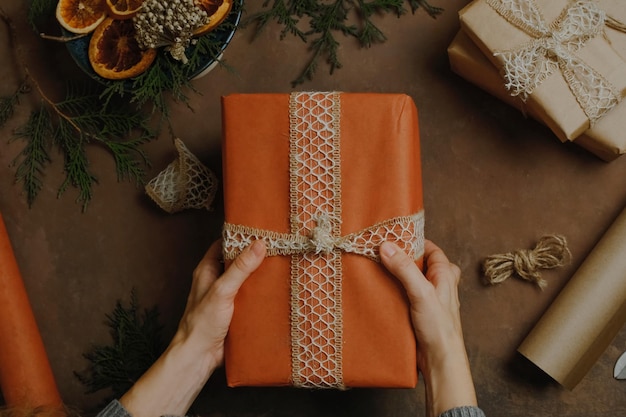 Female hands with Christmas gift