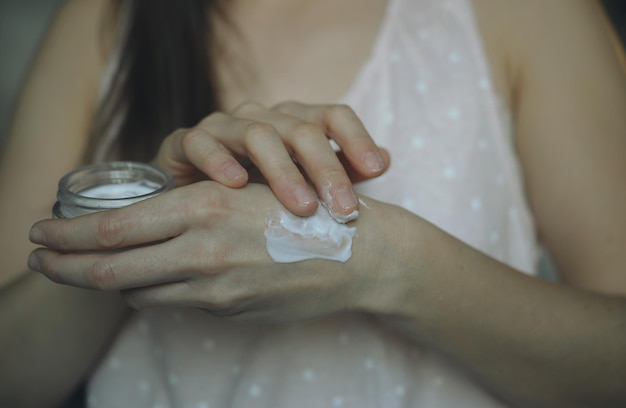 Photo female hands with cream skin care concept