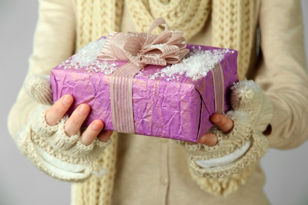 Female hands with gift box, close-up