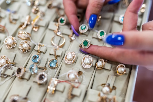 Female hands with golden jewellery close up