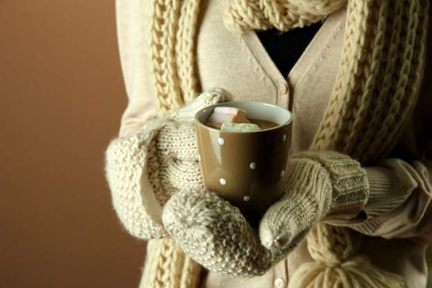 Female hands with hot drink