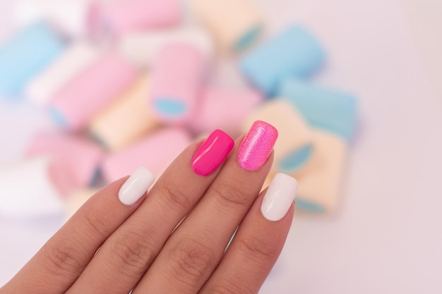 Female hands with multicolored manicure nails