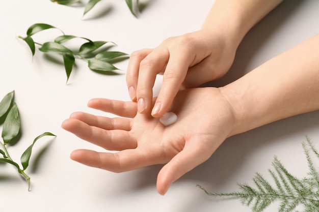 Female hands with natural cream