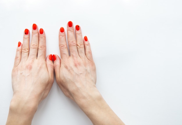 Female hands with red manicure