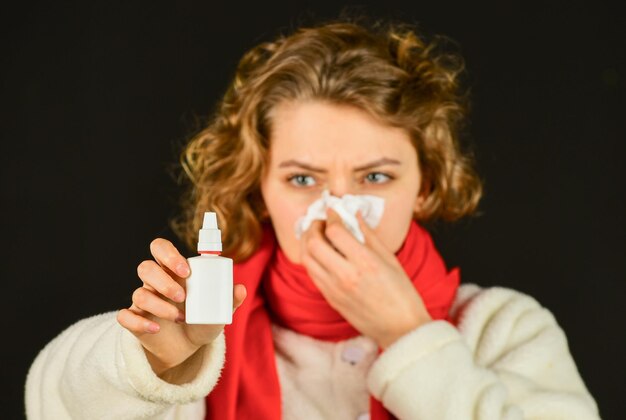 Female health concept woman with cold flu use nasal spray illness infection concept contagious respirator disease coronavirus novel chinese virus pandemic epidemic outbreak nCoV strain