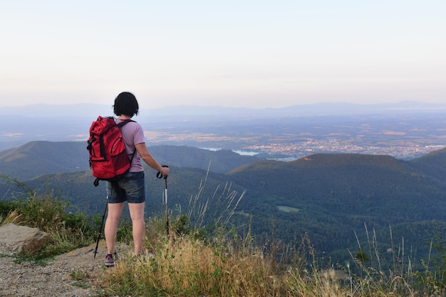 A female hiker who has reached the top