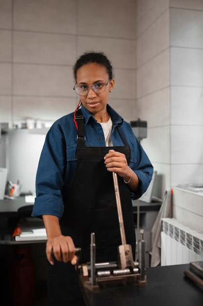 Female jeweler working in the shop