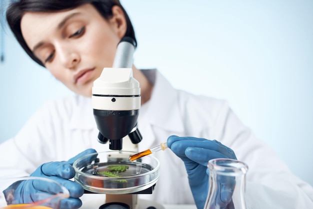 Female laboratory assistant arranging spectroscope research science biotechnology High quality photo