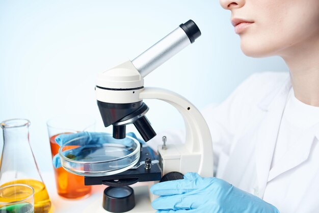 Female laboratory assistant research science microbiology analyzes