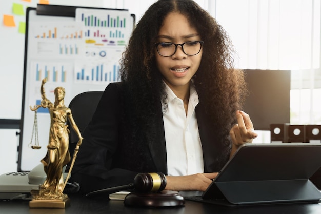 Female lawyer working at table at home office in the morning