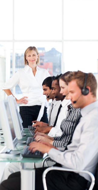 Female leader managing her team in a call center