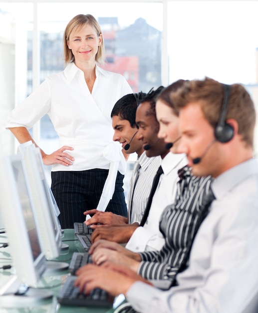 Female leader managing her working team in a call center