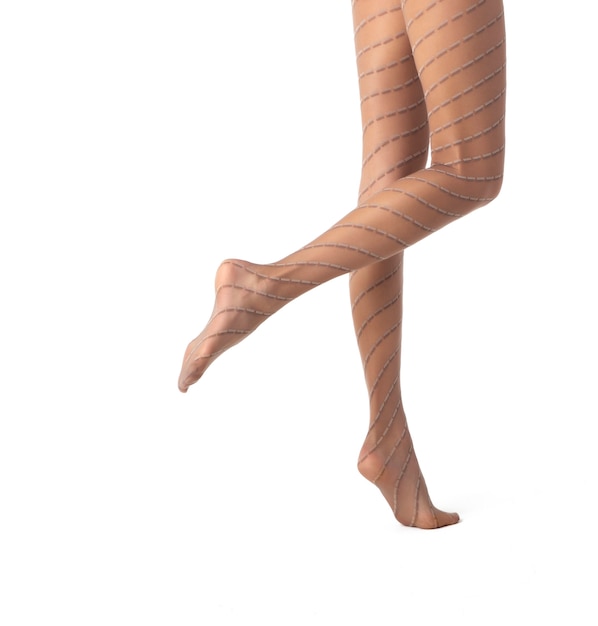 写真 白い背景で隔離のパターン化されたパンストの女性の脚