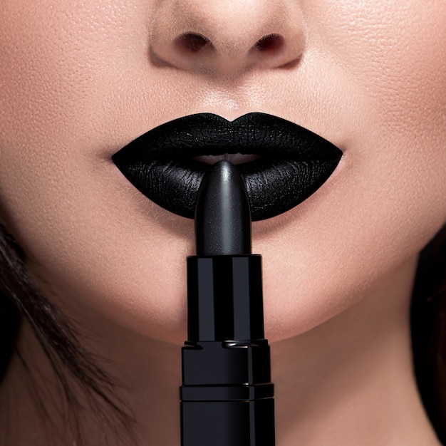 Female lips and black lipstick