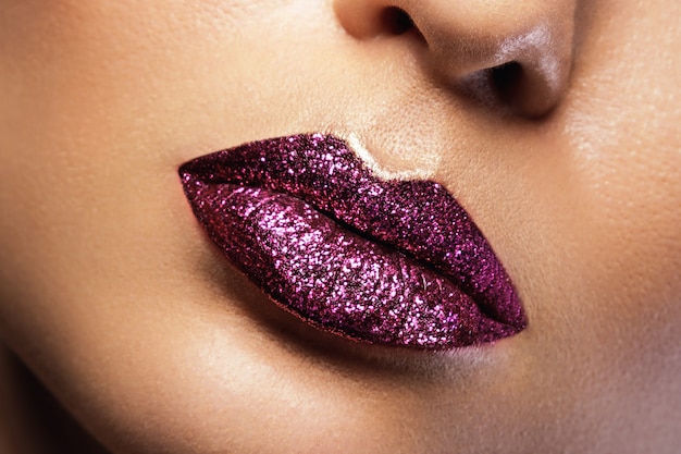 Female lips with glitters