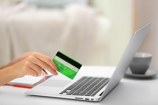 Female making online payment close up