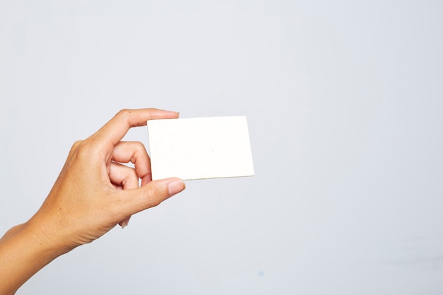 Female or Male Hand Holding Blank Card On White