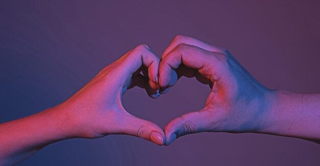 Female and male hands in form of heart hands in shape of love heart heart from hands love friendship