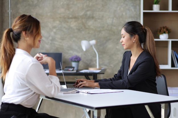 female manager in office discussing and interviewing job applicant for new employees businesswomen and colleagues discussing and discussing work on business projects together