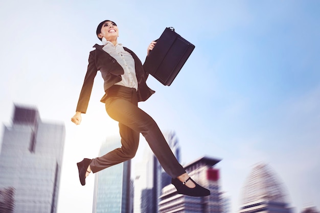 Female manager run fast with cityscape background