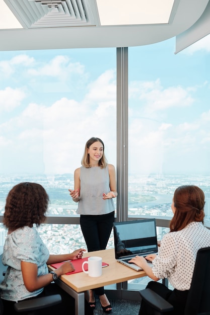 Female manager talking to colleagues