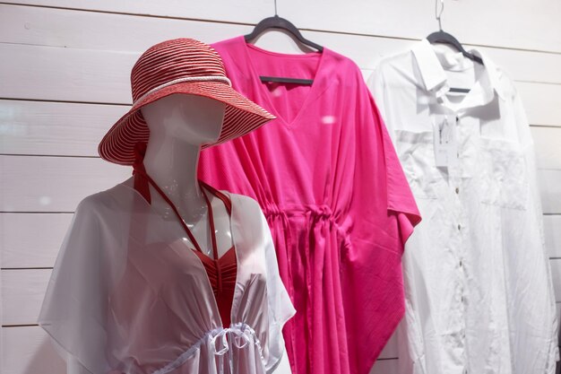 Female mannequin in pink beach hat closeup