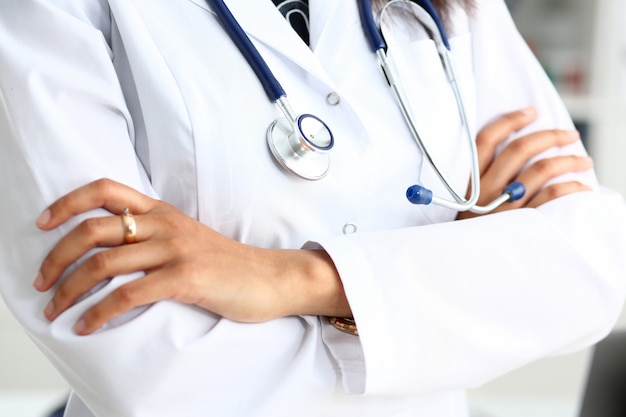 Female medicine doctor hands crossed