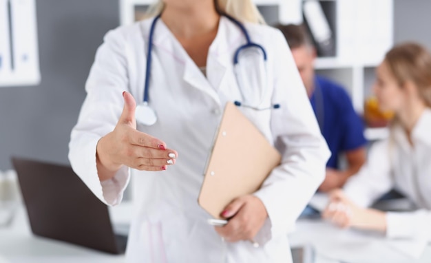 Female medicine doctor hold pad and give arm