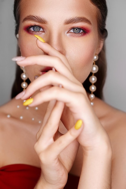 female model with graceful hands and perfect visage on smooth face