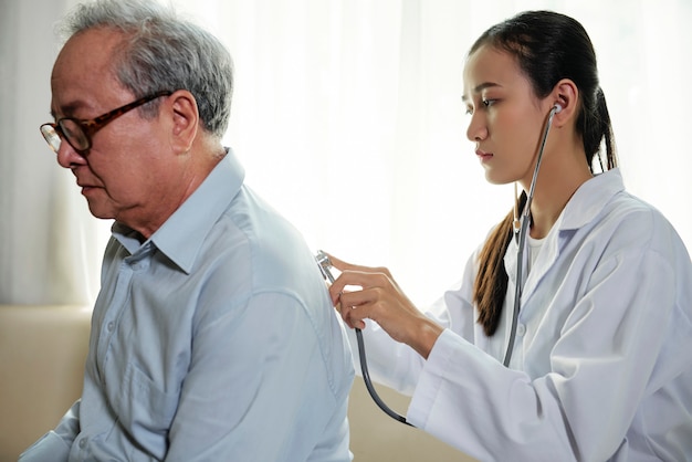 Female nurse listening to her patient