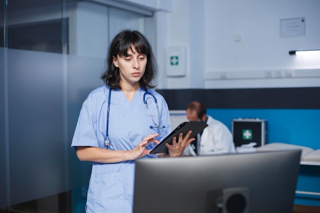 Female nurse using modern technology