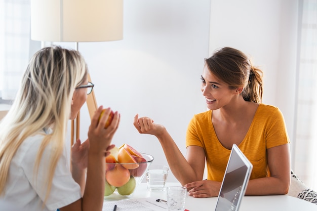 Female nutritionist giving consultation to patient