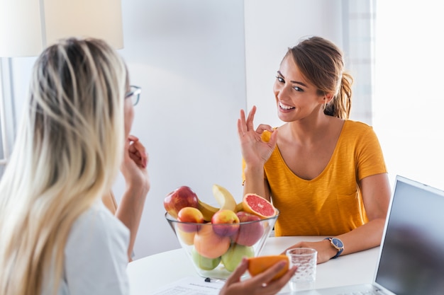 Female nutritionist giving consultation to patient