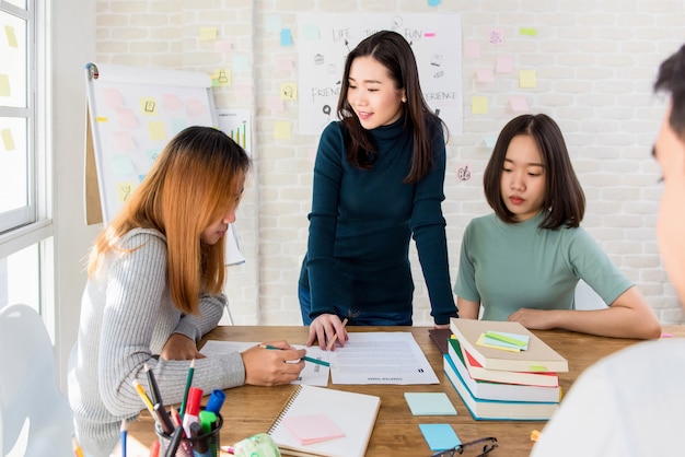 Female oversea college students discussing group project