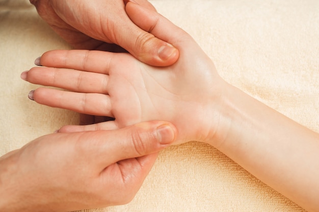 Female palm massaging closeup