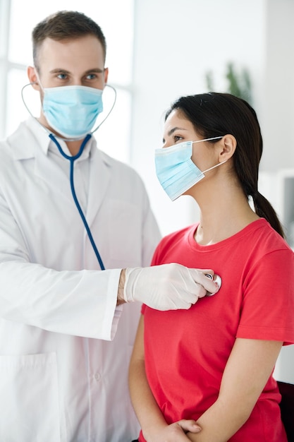 Female patient for examination by doctor with stethoscope in hospital High quality photo